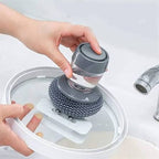Soap dispensing palm brush